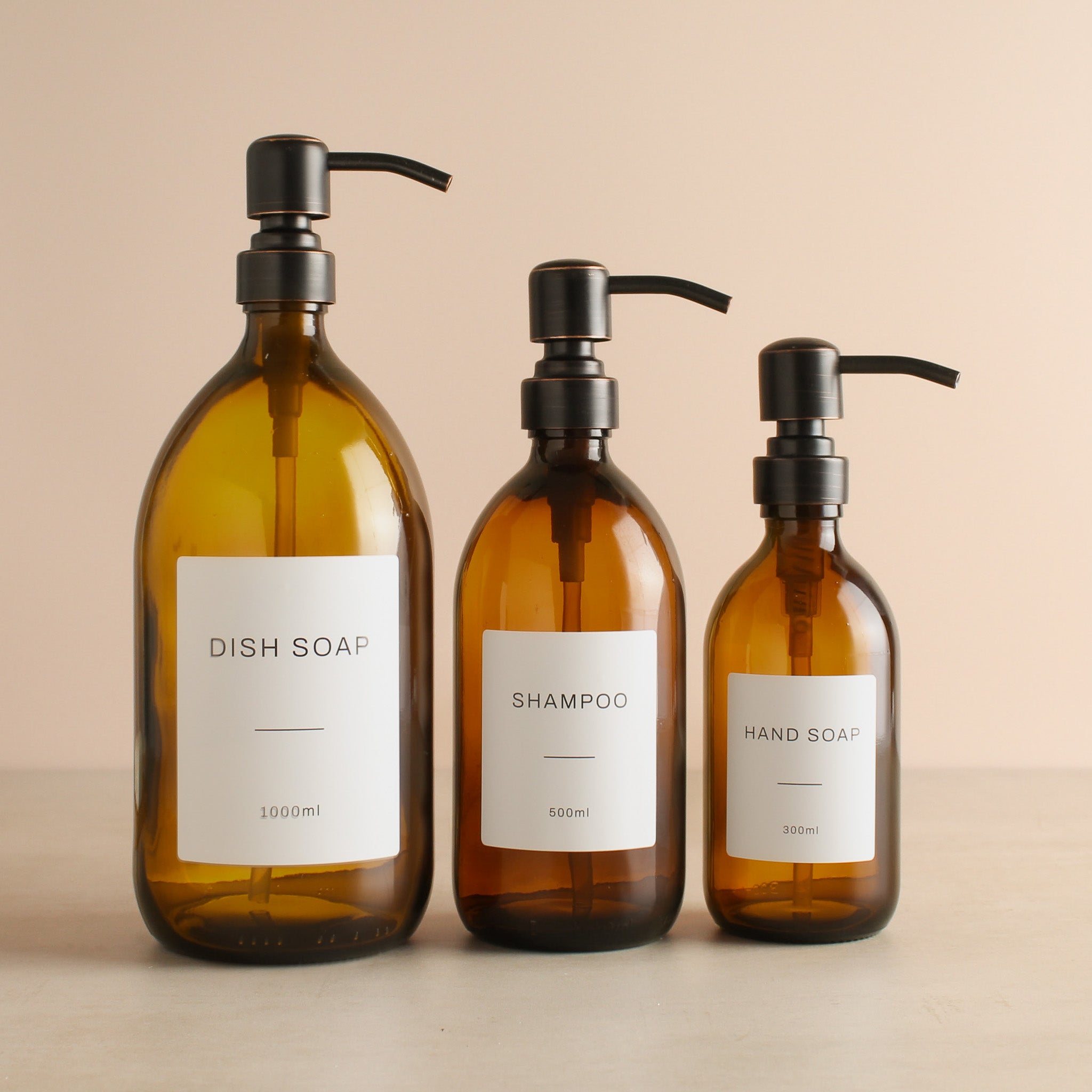 Labelled Amber Glass Dispenser Bottle With Black/Copper Pump - Namie Home