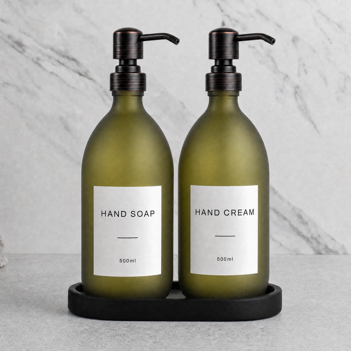 Black Tray & Frosted Green Glass Hand Soap & Hand Cream Set on a black stone tray, black and copper pumps