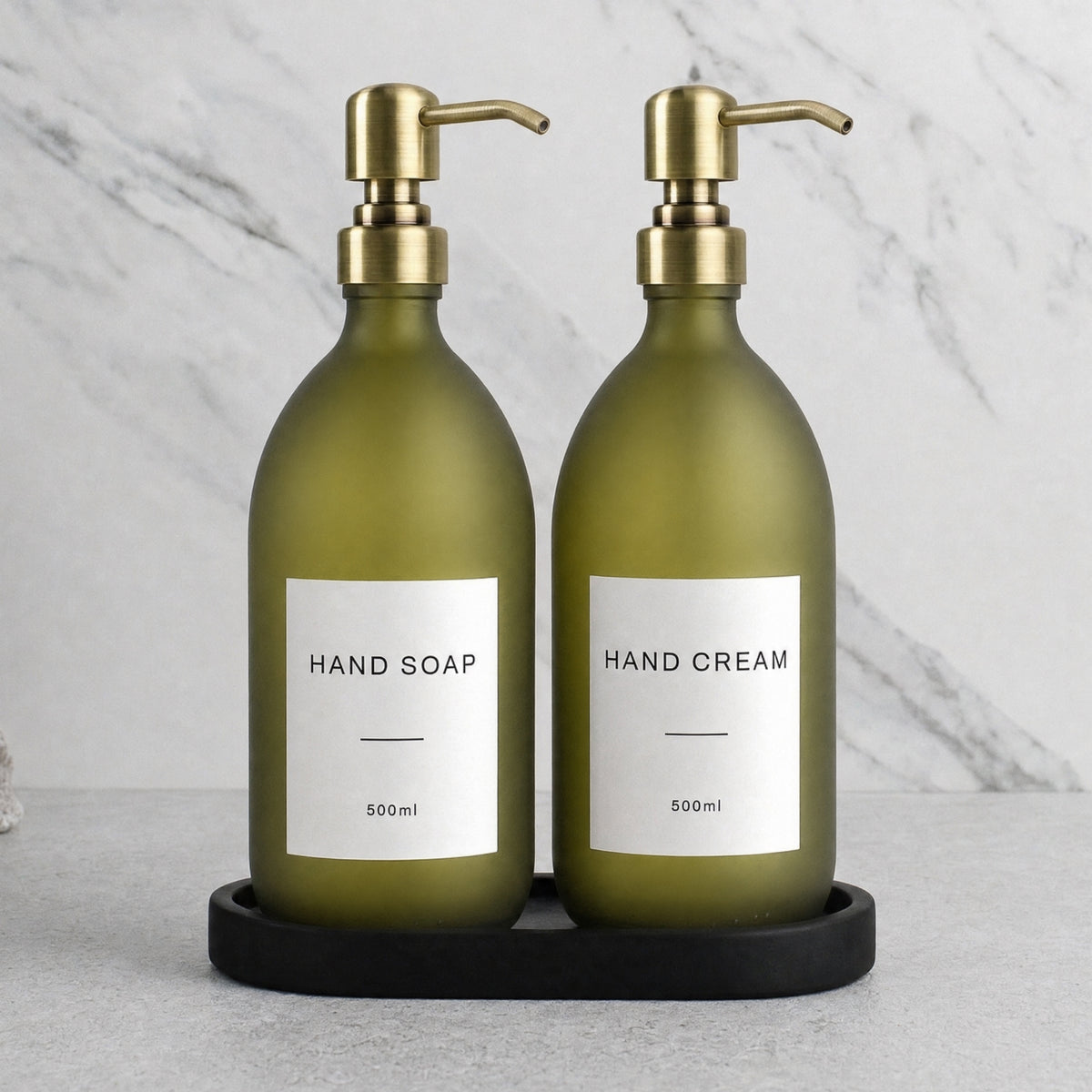Black Tray & Frosted Green Glass Hand Soap & Hand Cream Set on a black stone tray, gold pumps