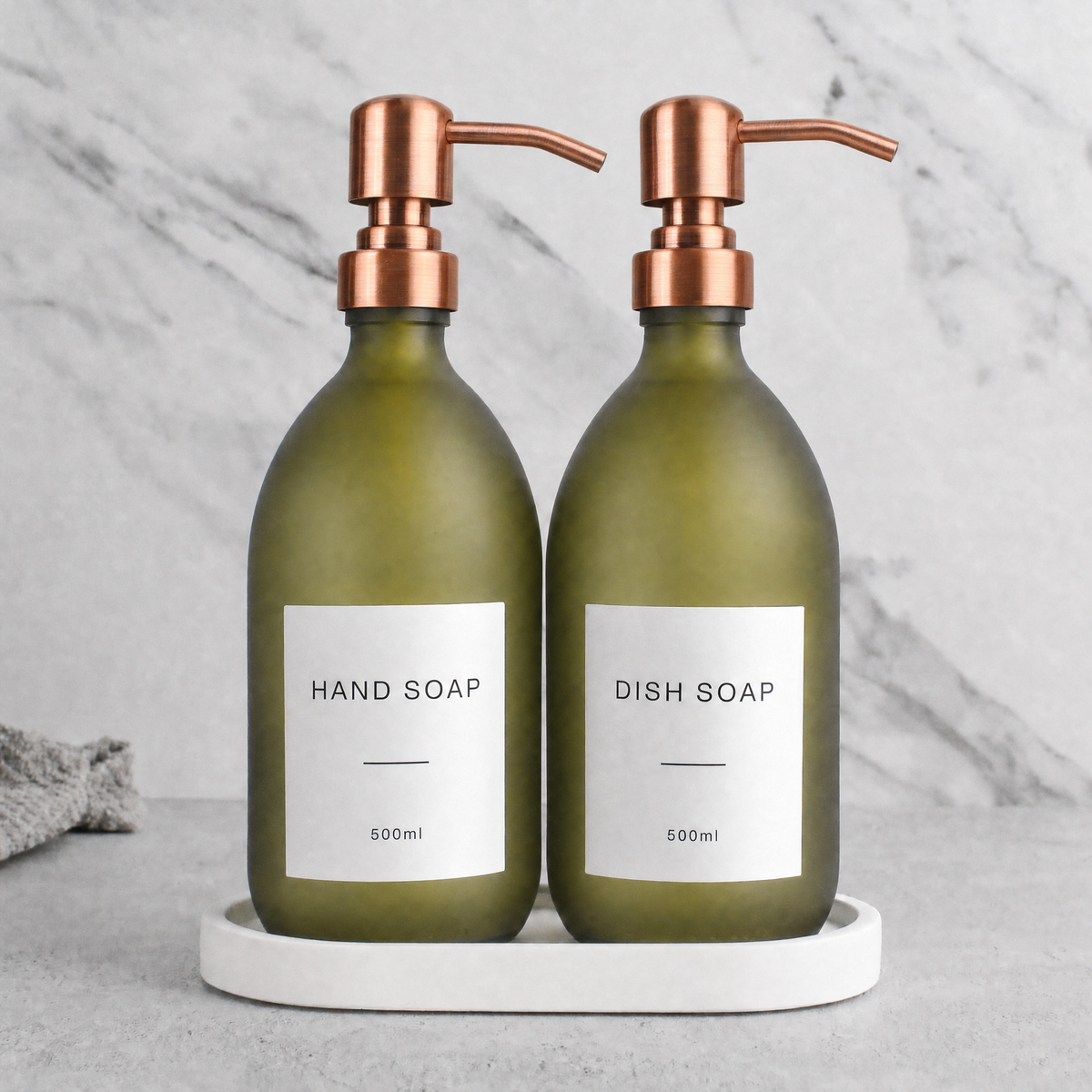 White Tray & Frosted Green Glass Hand Soap & Dish Soap Set on a white stone tray, rose gold pumps