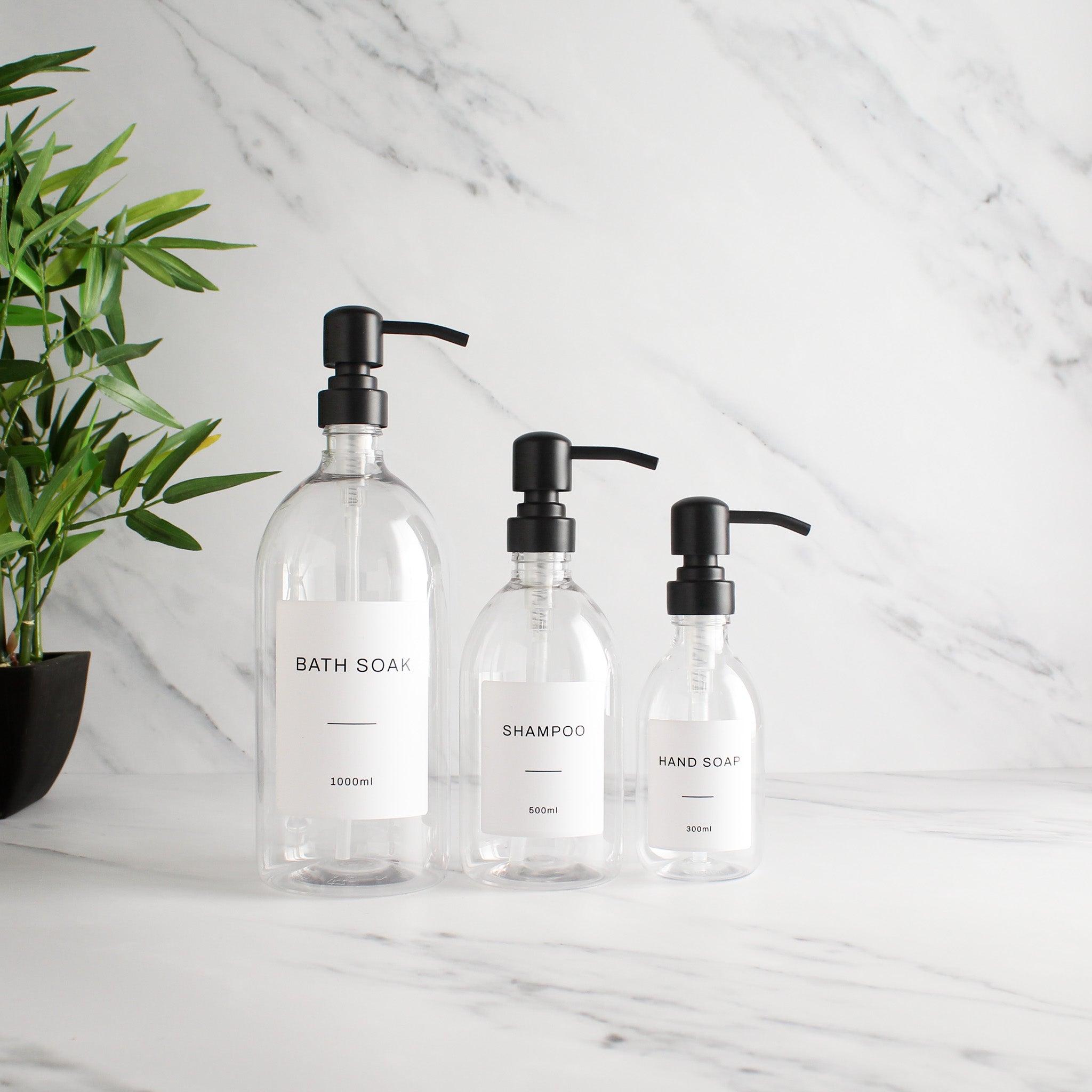 Labelled Clear Plastic Dispenser Bottle With Matte Black Pump - Namie Home