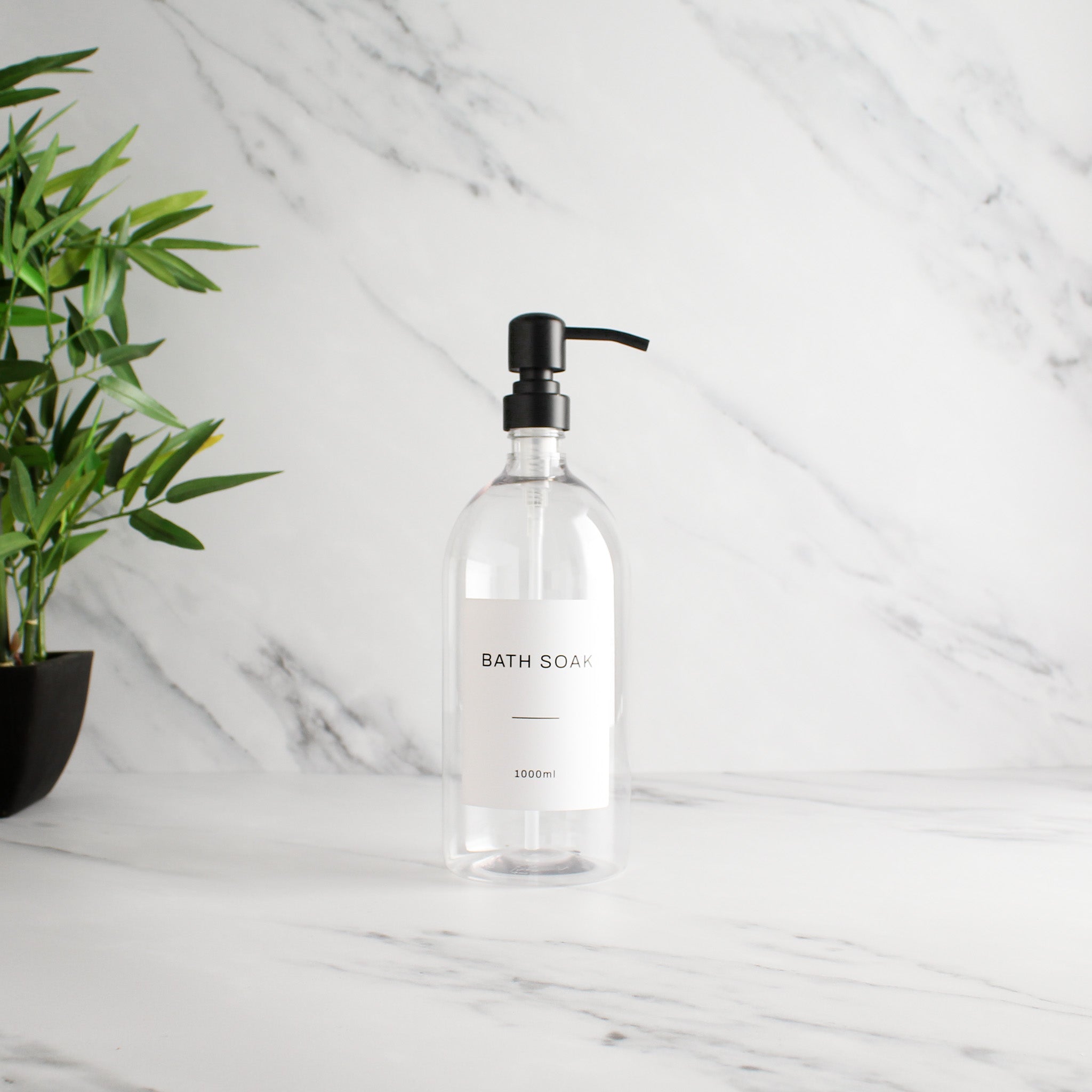 Labelled Clear Plastic Dispenser Bottle With Matte Black Pump - Namie Home
