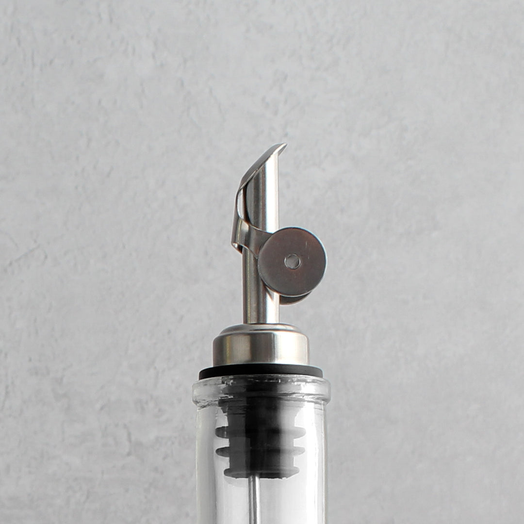 Clear Glass Tall Neck Oil Bottle With Label