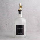 Frosted White Glass Tall Neck Oil Bottle With Label - gold lid