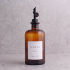 Amber glass oil bottle with black lid