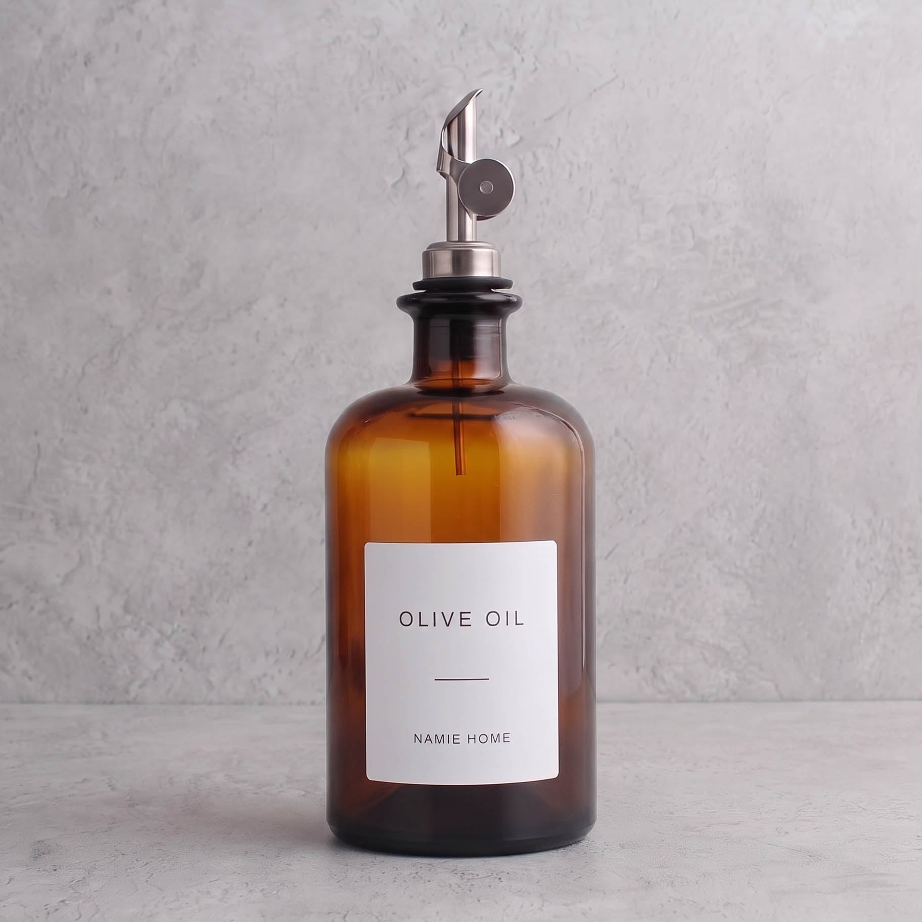 Amber glass oil bottle with silver lid