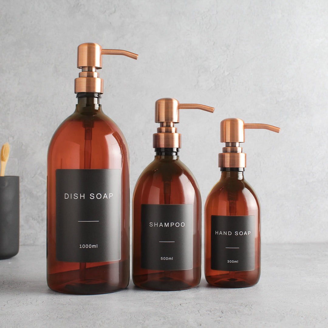 Labelled Amber Plastic Dispenser Bottle With Rose Gold Pump