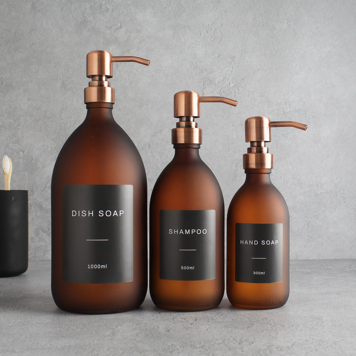 Labelled Frosted Amber Glass Dispenser Bottle With Rose Gold Pump