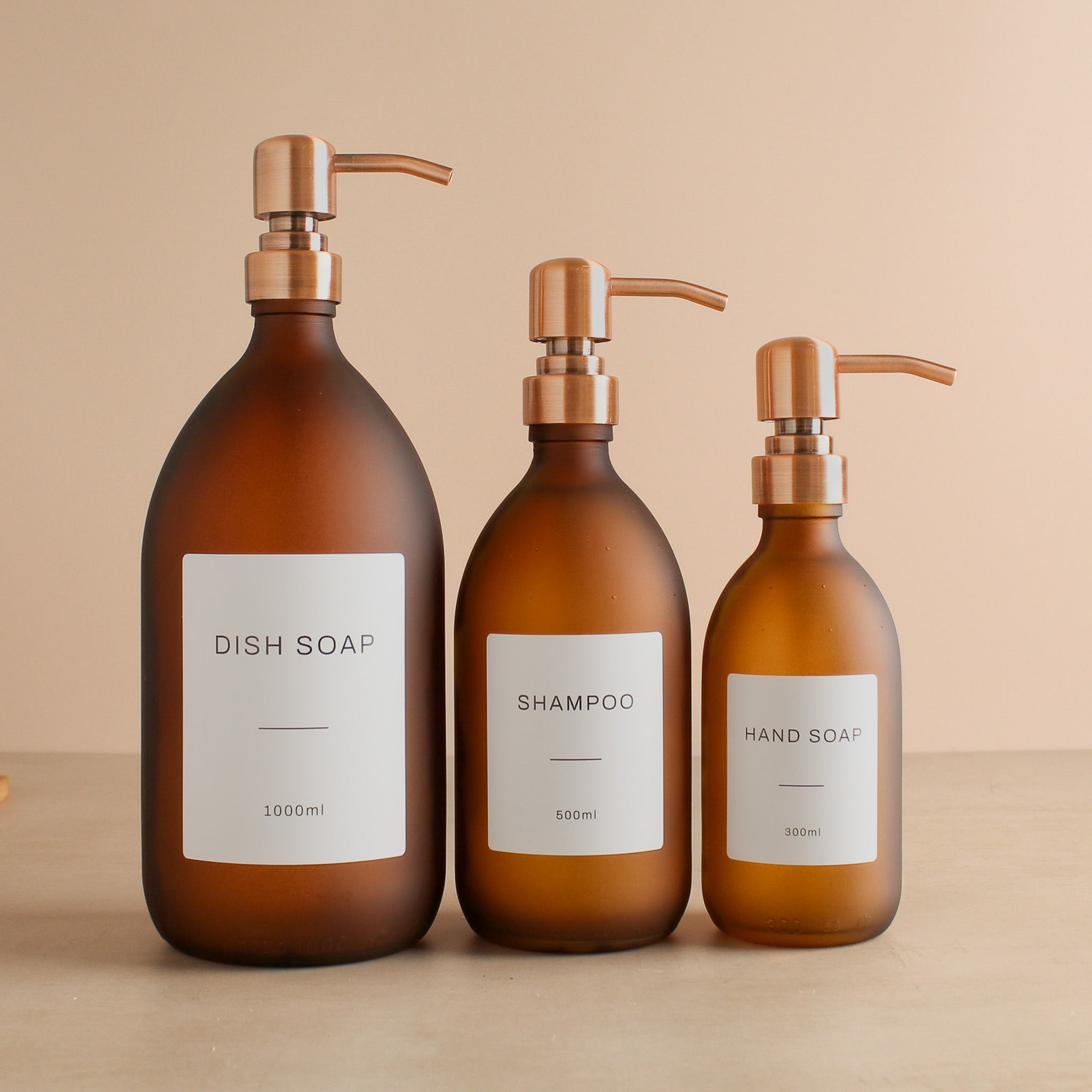 Labelled Frosted Amber Glass Dispenser Bottle With Rose Gold Pump - Namie Home