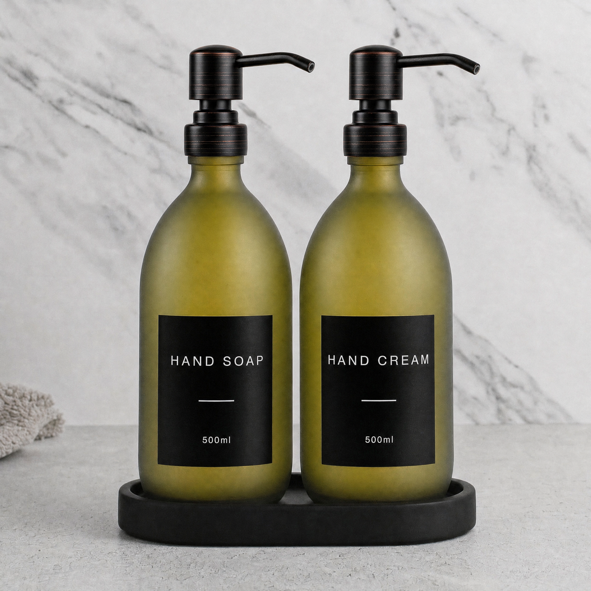 Black Tray & Frosted Green Glass Hand Soap & Hand Cream Set on a black stone tray, black and copper pumps