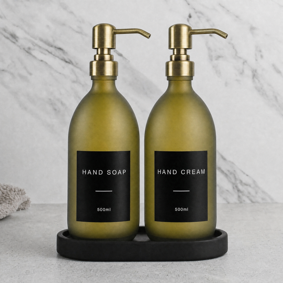 Black Tray & Frosted Green Glass Hand Soap & Hand Cream Set on a black stone tray, gold pumps