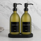 Black Tray & Frosted Green Glass Hand Soap & Hand Cream Set on a black stone tray, matte black pumps
