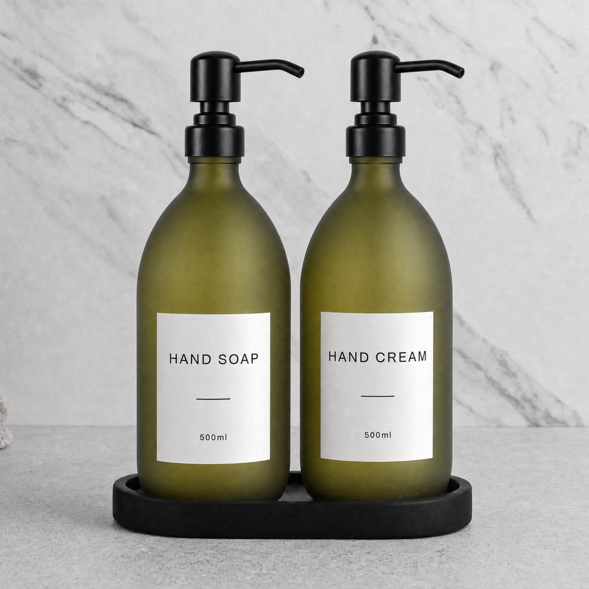 Black Tray & Frosted Green Glass Hand Soap & Hand Cream Set on a black stone tray, matte black pumps