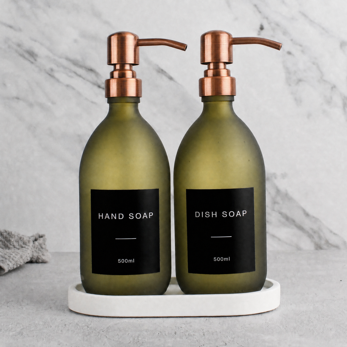White Tray & Frosted Green Glass Hand Soap & Dish Soap Set on a white stone tray, rose gold pumps
