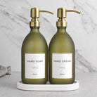 White Tray & Frosted Green Glass Hand Soap & Hand Cream Set on a white stone tray, gold pumps