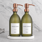 White Tray & Frosted Green Glass Hand Soap & Hand Cream Set on a white stone tray, rose gold pumps