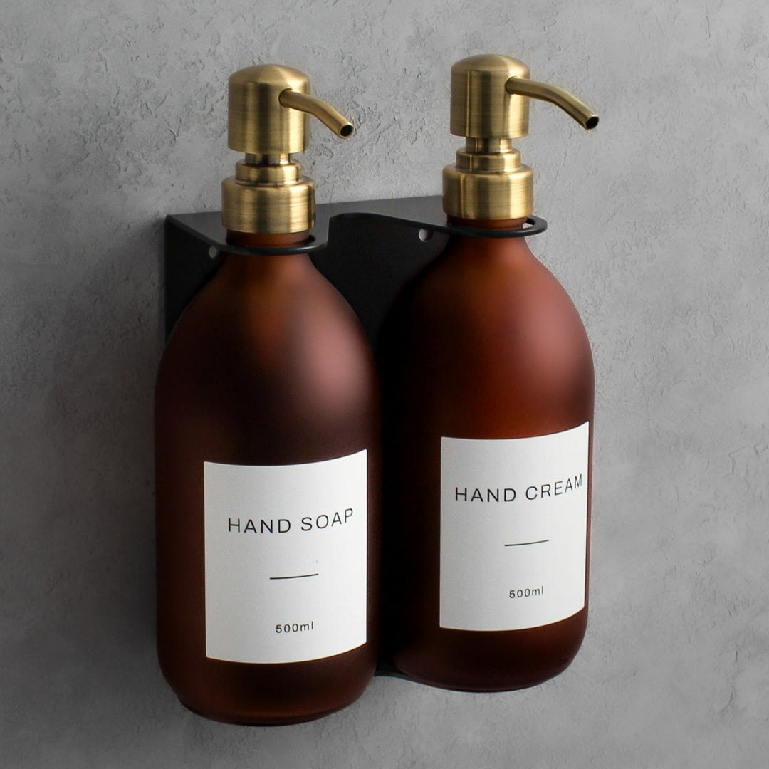 Frosted amber glass soap dispenser bottle set on metal wall mounted bracket for hand soap and hand cream for hotels, home, spas, cafe, restaurant, b&b