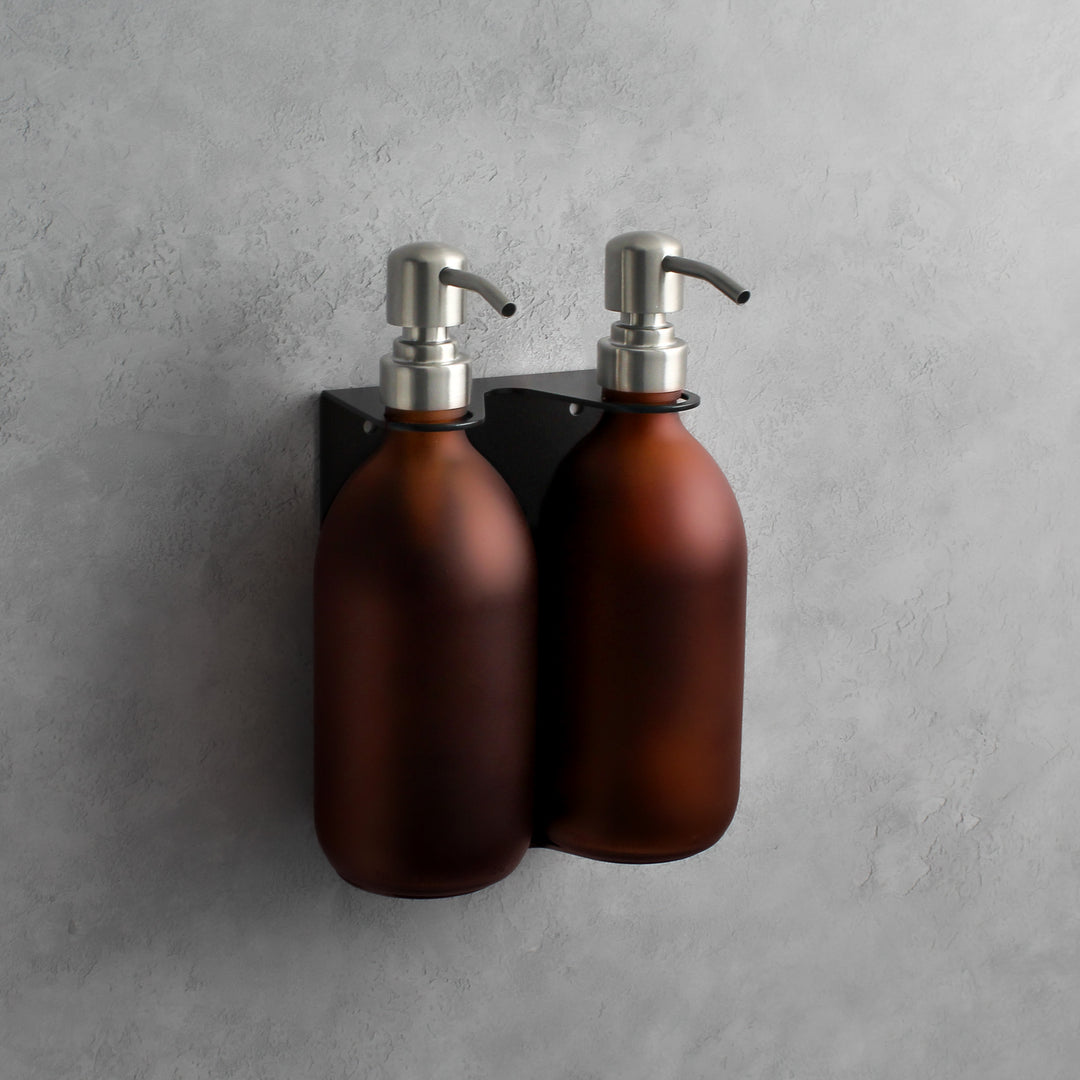 Frosted amber glass soap dispenser bottle set on metal wall mounted bracket for hand soap and hand cream for hotels, home, spas, cafe, restaurant, b&b