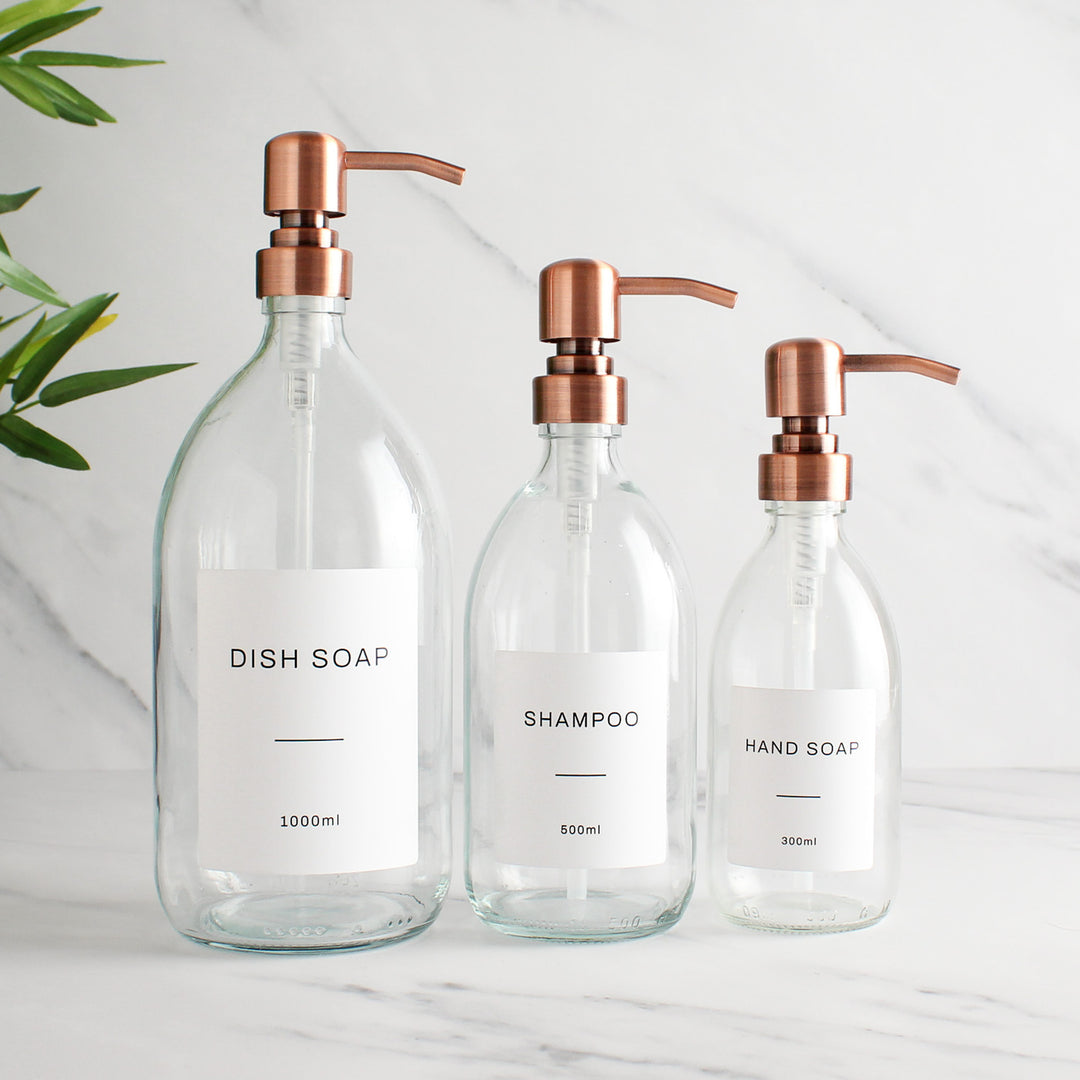 Labelled Clear Glass Dispenser Bottle With Rose Gold Pump