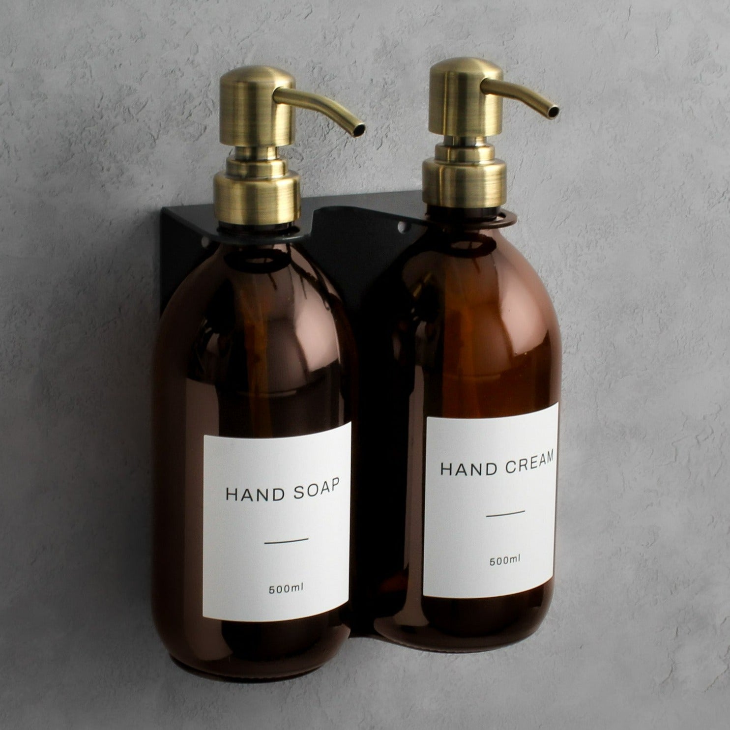 Amber glass soap dispenser bottle set on metal wall mounted bracket for hand soap and hand cream for hotels, home, spas, cafe, restaurant, b&b