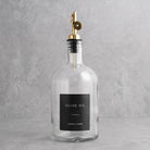 Clear Glass Tall Neck Oil Bottle With Label - gold lid
