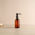 Amber Plastic Dispenser Bottle With Matte Black Pump - Namie Home