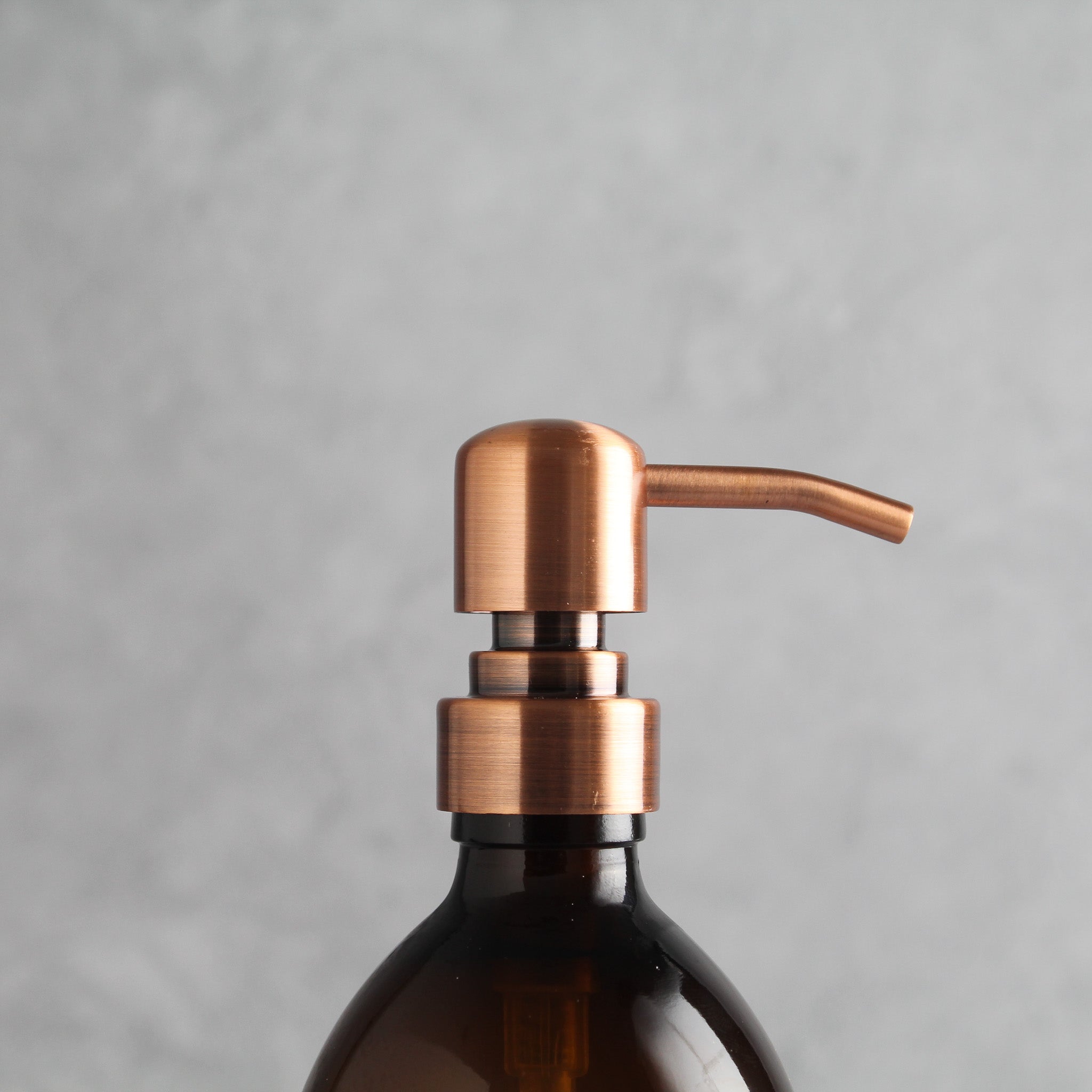 Labelled Amber Glass Dispenser Bottle With Rose Gold Pump - Namie Home