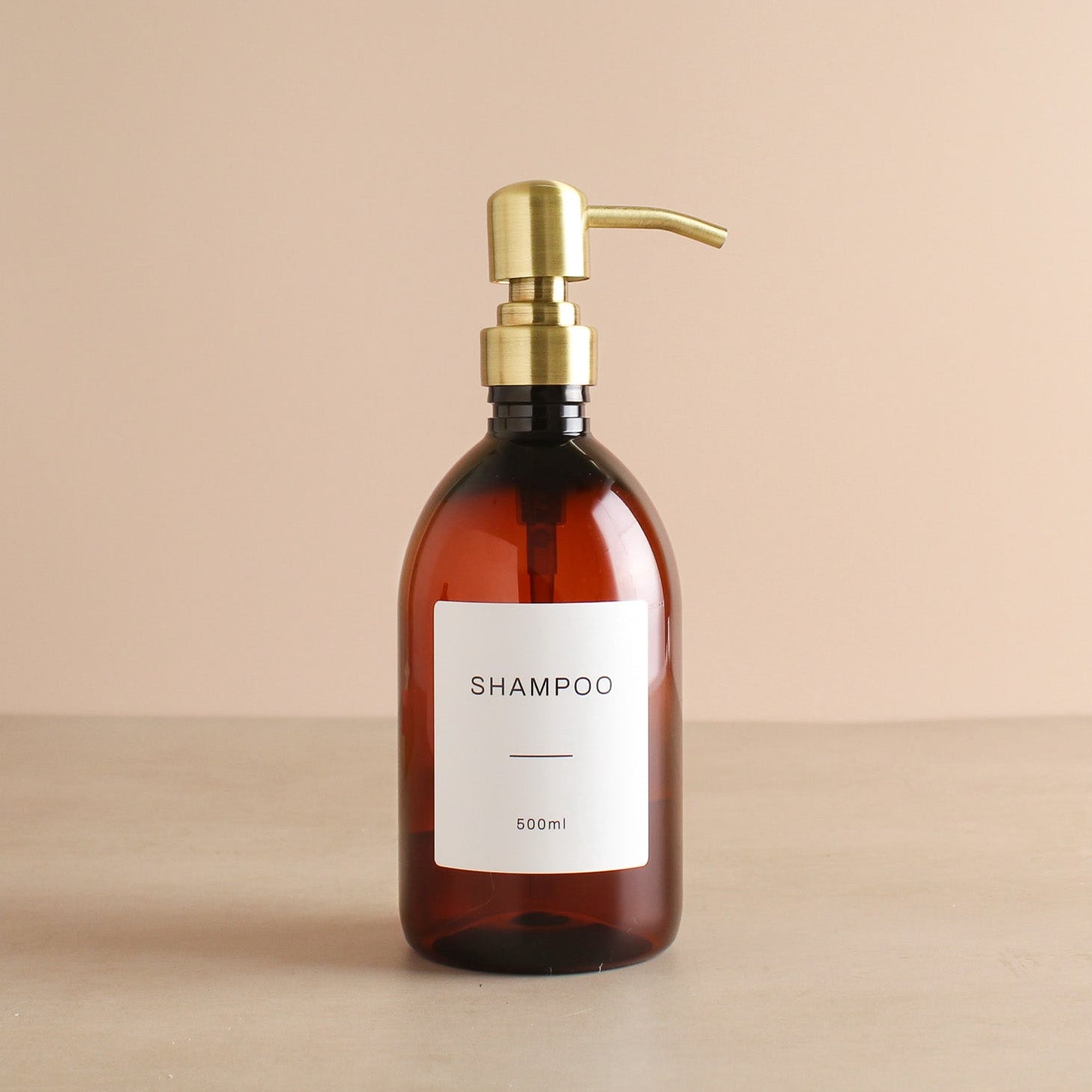 Labelled Amber Plastic Dispenser Bottle With Gold Pump - Namie Home