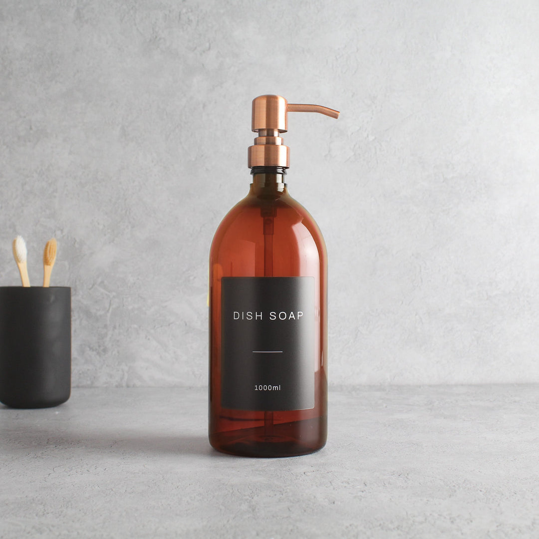 Labelled Amber Plastic Dispenser Bottle With Rose Gold Pump - Namie Home