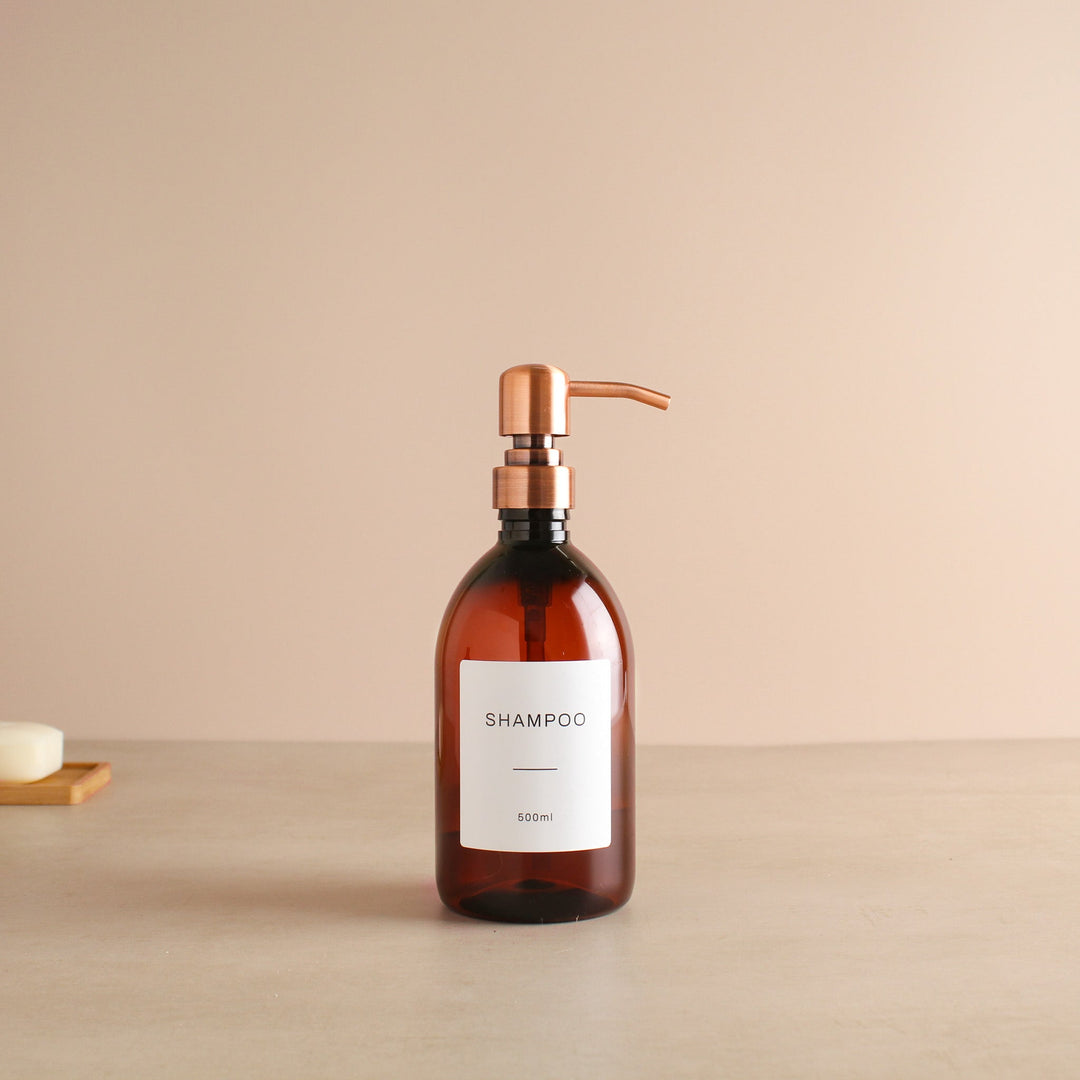 Labelled Amber Plastic Dispenser Bottle With Rose Gold Pump - Namie Home