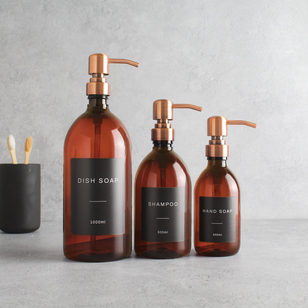 Labelled Amber Plastic Dispenser Bottle With Rose Gold Pump - Namie Home