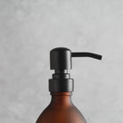 Labelled Frosted Amber Glass Dispenser Bottle With Matte Black Pump - Namie Home