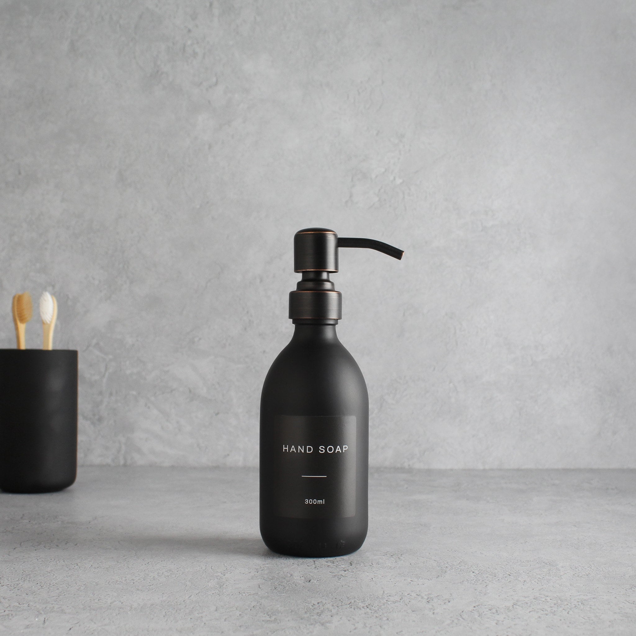 Labelled Matte Black Glass Dispenser Bottle With Black/Copper Pump - Namie Home